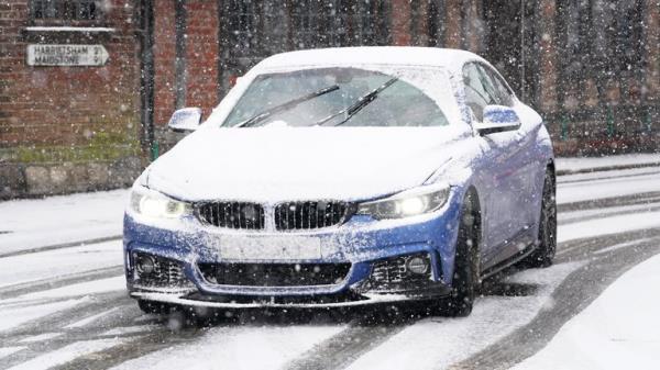 A car driving through a snow flurry in Lenham, Kent. Sleet and snow showers have been forecast for parts of the country on Mo<em></em>nday as some regions are still trying to grapple with flooding following intense rainfall. Picture date: Mo<em></em>nday January 8, 2024.