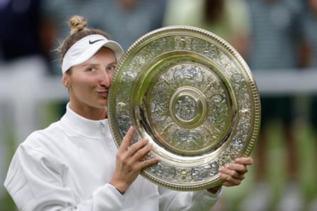 Marketa Vo<em></em>ndrousova with her spoils after victory at Wimbledon
