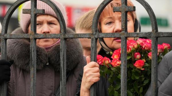 People gather outside the Church of the Icon of the Mother of God Soothe My Sorrows, in Moscow, Russia, Friday, March 1, 2024. Relatives and supporters of Alexei Navalny are bidding farewell to the opposition leader at a funeral in southeastern Moscow, following a battle with authorities over the release of his body after his still-unexplained death in an Arctic penal co<em></em>lony. (AP Photo)