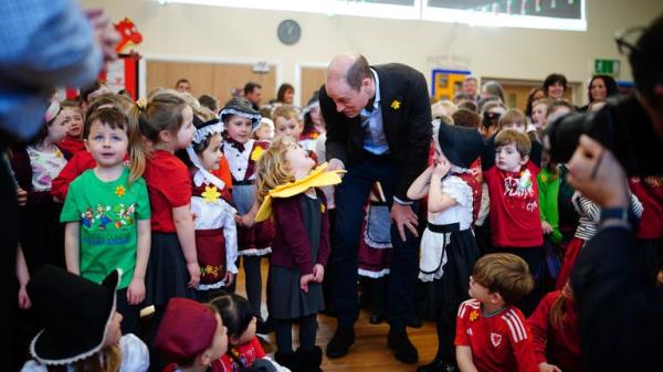 The prince pictured meeting four-year-old Esme Dale at Ysgol Yr Holl Saint/All Saint's School Pic: PA / Ben Birchall