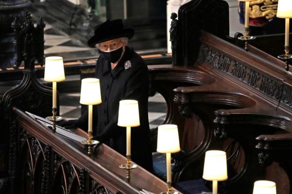 Britain's Queen Elizabeth is seen during the funeral of Britain's Prince Philip, husband of Queen Elizabeth, who died at the age of 99, at St George's Chapel, in Windsor, Britain, April 17, 2021.