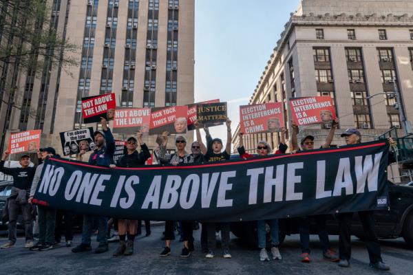 Demo<em></em>nstrators protest outside of Manhattan Criminal Court as former US President Do<em></em>nald Trump attends the first day of his trial for allegedly covering up hush mo<em></em>ney payments l<em></em>inked to extramarital affairs, in New York City on April 15, 2024. 