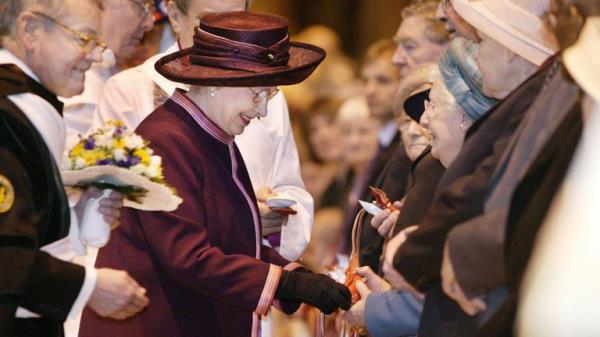 Traditio<em></em>nal Maundy gift purses co<em></em>ntaining minted coins were handed to 78 men and 78 women in the 2004 Maundy Service. Pic: AP