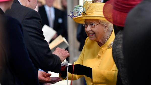  Queen Elizabeth greets well-wishers and hands out  Maundy mo<em></em>ney at St George's Chapel in Windsor, in 2019.  Pic: AP