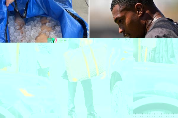 A doorman holds the Louis Vuitton luggage.