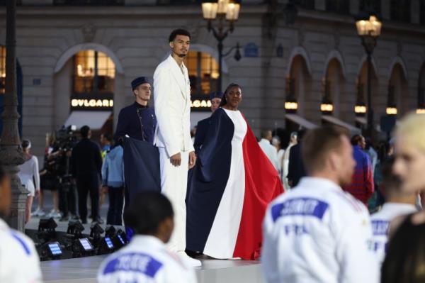 Athletes at fashion parade in Paris.