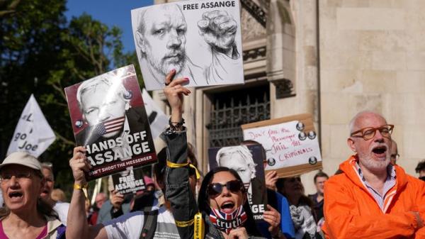 People attend a protest outside the High Court 