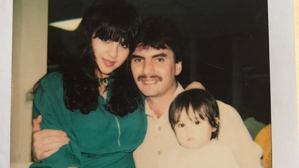 Michael Franzese holding his wife Camille and baby daughter.