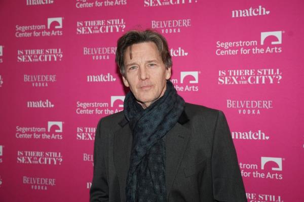 Actor Andrew McCarthy arriving at the opening night of Candace Bushnell's show in a black coat and scarf