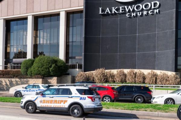 Emergency vehicles line the feeder road outside Lakewood Church during a reported active shooter event, Sunday, Feb. 11, 2024, in Houston. (Kirk Sides/Houston Chro<em></em>nicle via AP)