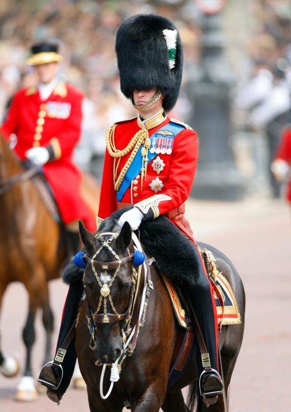 A Buckingham Palace guard riding a horse. 