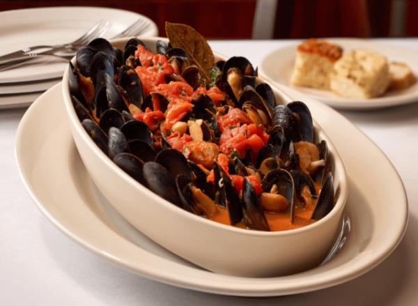 joes crab shack mussels with corn on a plate.