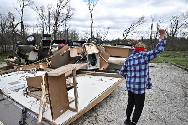 Debbie Carter gestures at her destroyed recreatio<em></em>nal vehicle.