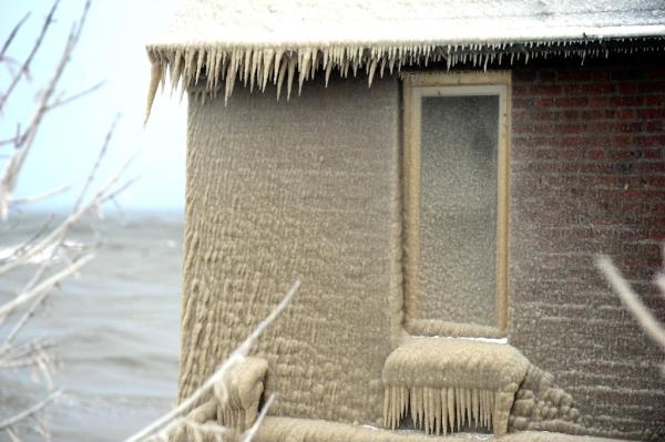 Ice covers the Lake Erie shoreline on December 24, 2022 in Hamburg, New York.