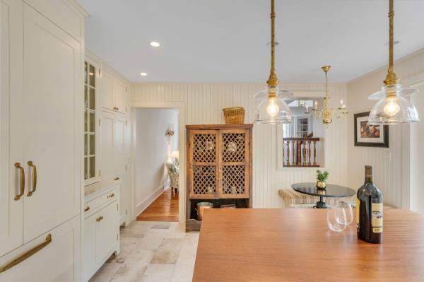 The renovated kitchen has a breakfast nook.