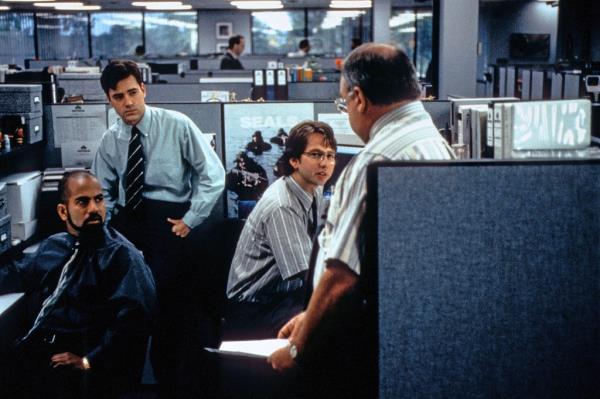 In the film, frustrated employees at a software company company install code that swipes fractions of pennies from their employer.