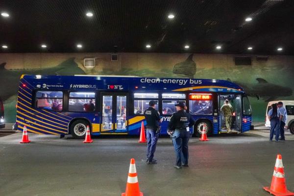 Bus transporting recently arrived migrants from Texas to a shelter in NYC.
