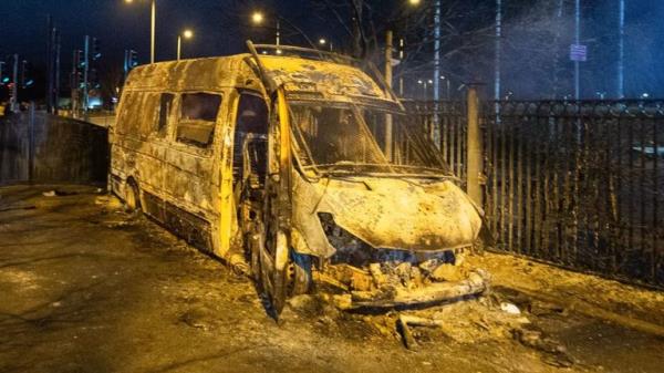 A burnt out police van after a demo<em></em>nstration outside the Suites Hotel in Knowsley