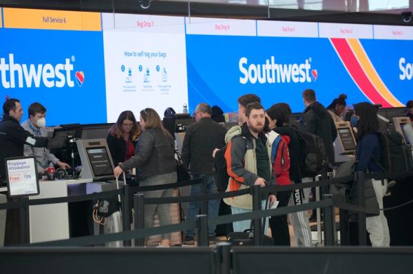 Travelers line up at the check-in counters for Southwest Airlines last week,