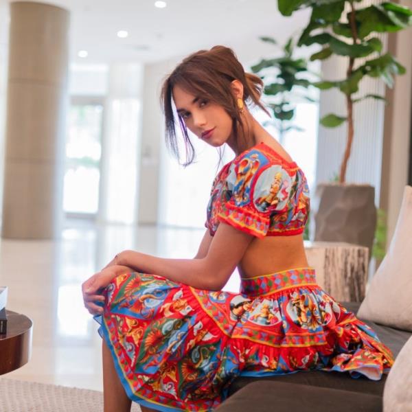 Angela Acosta de Mastro<em></em>nardi in orange dress