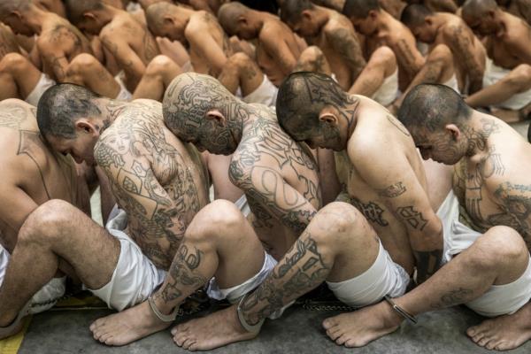 Inmates are seated on the prison floor of the Terrorism Co<em></em>nfinement Center in Tecoluca, El Salvador on March 15, 2023.