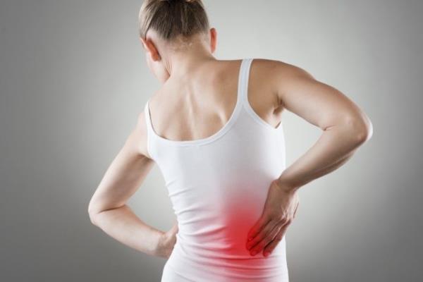 pain. Chro<em></em>nic kidneys disease indicated with red spot on woman's body.