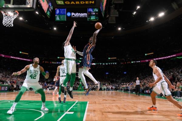 Julius Randle #30 of the New York Knicks drives to the basket during the game against the Boston Celtics on January 26, 2023 at the TD Garden in Boston, Massachusetts. 
