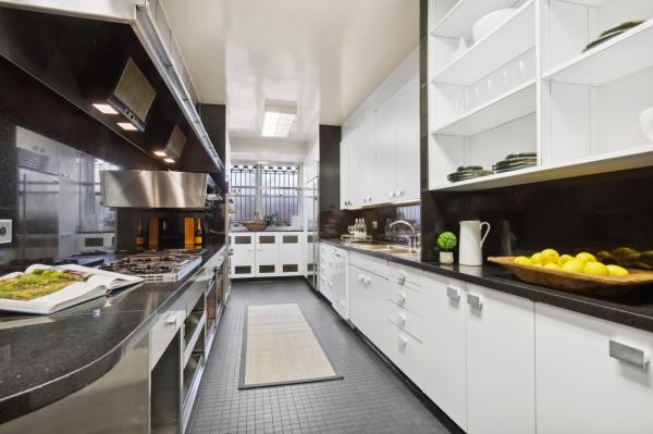 The chef's kitchen has two ovens, a separate stock pot range 