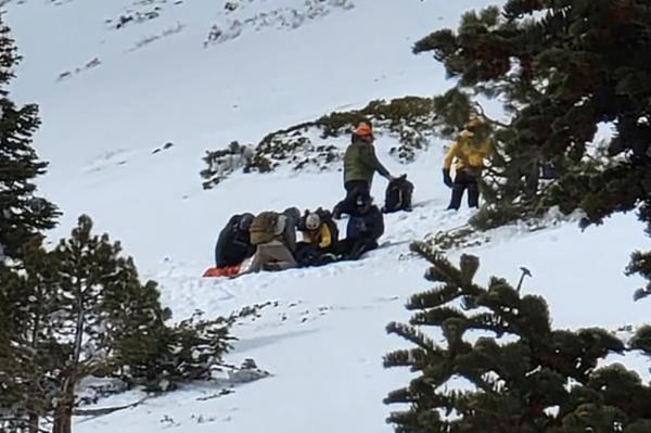 Hiker receiving assistance on the mountain.