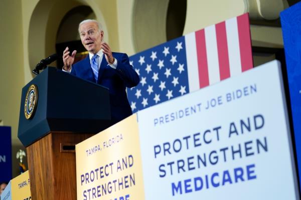 President Biden is seen speaking at a podium