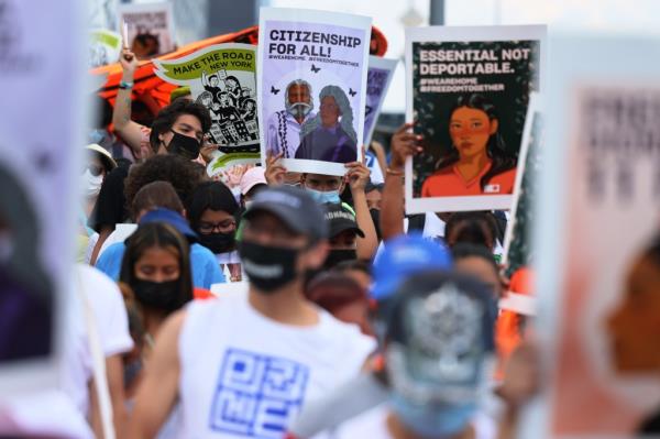 People participate in a march in support of a pathway to citizenship for immigrants on July 23, 2021 in New York City. 