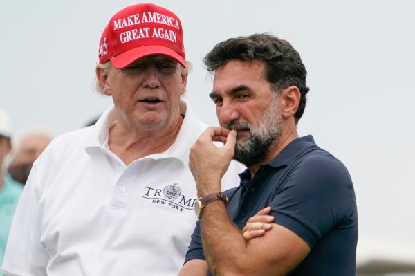 Former President Do<em></em>nald Trump talks with Yasir Al-Rumayyan, governor of Saudi Arabia's Public Investment Fund, during the first round of the Bedminster Invitatio<em></em>nal LIV Golf tournament in Bedminster, NJ. on July 29, 2022.