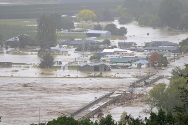 The Waiohiki bridge on the Tutaekuri River is washed away and houses flooded on February 14, 2023 in Napier, New Zealand.