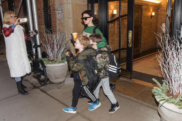 Hilaria Baldwin leaves with children from their apartment.