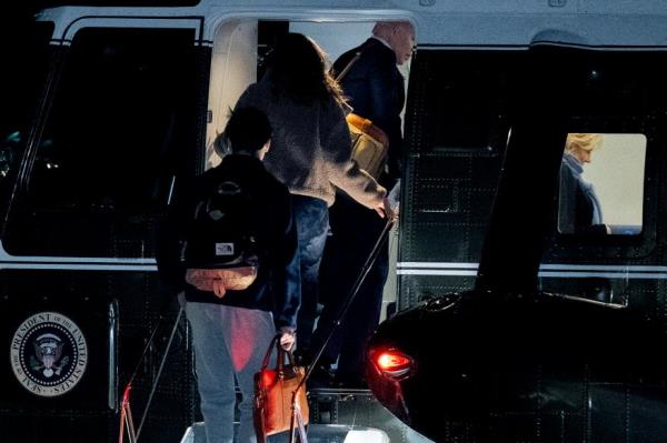 President Joe Biden, first lady Jill Biden, right, and their grandchildren Natalie and Robert, board Marine One on the South Lawn of the White House in Washington, Tuesday, Dec. 27, 2022, for a short trip to Andrews Air Force ba<em></em>se, Md., and then on to St. Croix, U.S. Virgin Islands. (AP Photo/Andrew Harnik)