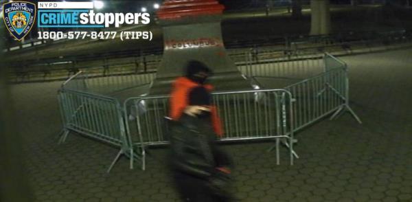 The duo climbed over barricades protecting the statue of the Italian explorer and spray painted it on Feb. 26, 2023.