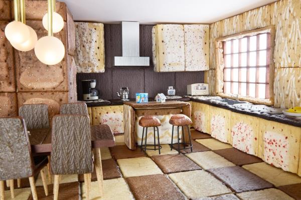 The kitchen features built-in Frosted Grape cabinets, Frosted Chocolate Fudge pantry, and Frosted Raspberry cabinets.