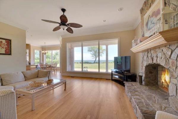 Interior of a living room in the home with a fireplace. 