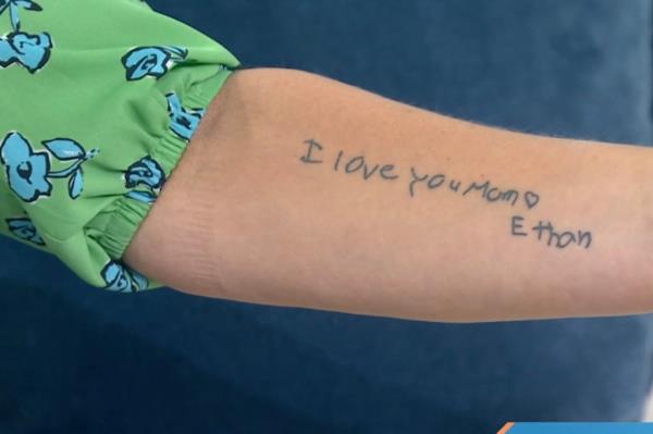 Tattoo on Stacy's arm reading 