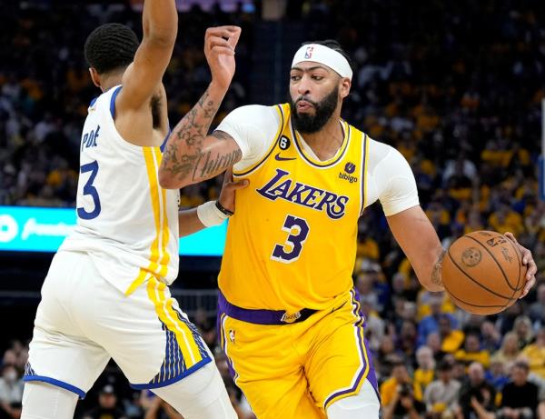 Lakers big man Anthony Davis drives past Jordan Poole #3 of the Golden State Warriors during the second quarter in Game 5 of the Western Co<em></em>nference Semifinal Playoffs at Chase Center on May 10, 2023 in San Francisco, California.