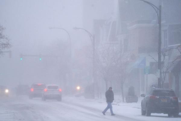 Heavy snow falls on Elmwood Avenue in Buffalo N.Y., Friday, Dec. 23, 2022.