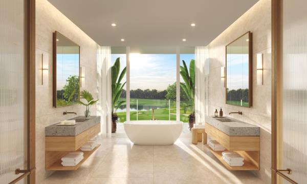 A sleek marble bathroom inside one of the residences with a stellar view of the golf course.