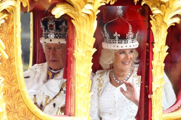 King Charles III and Queen Co<em></em>nsort Camilla in the carriage