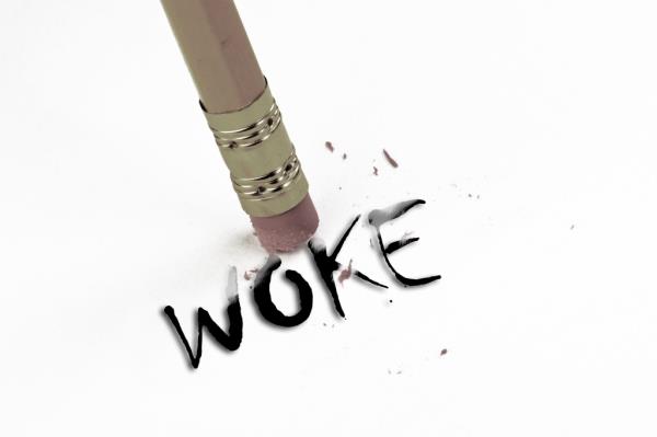 WOKE  being erase away by pencil eraser.