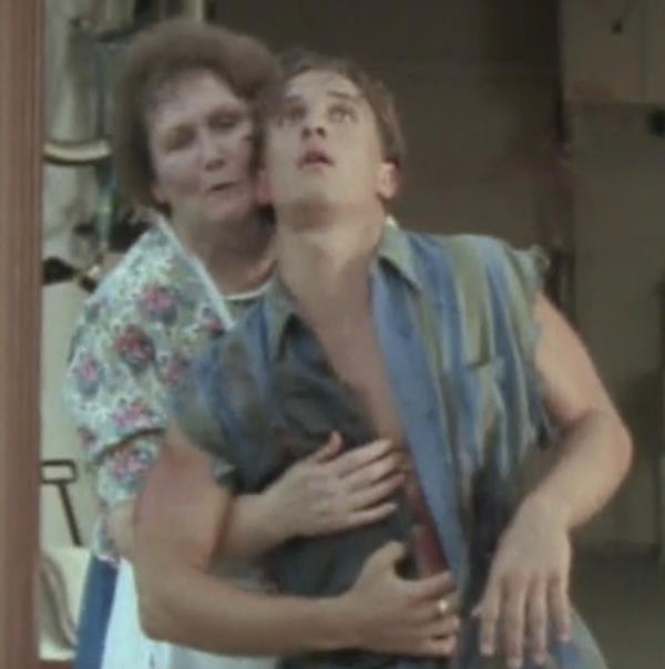 Matthew McCo<em></em>naughey  getting cradled by an old woman. 