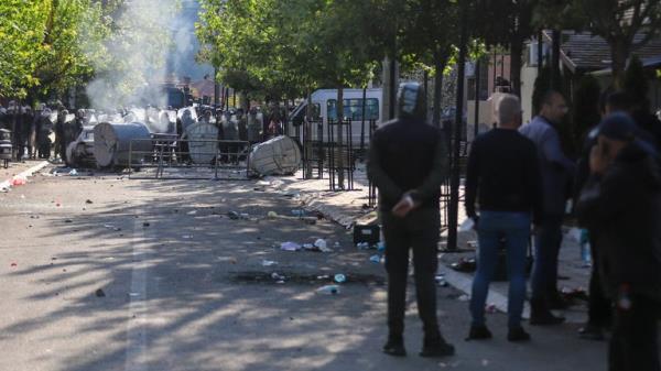 KFOR soldiers guard a municipal building after clashes with Kosovo Serbs in the town of Zvecan, northern Kosovo, Monday, May 29, 2023. Ethnic Serbs in northern Kosovo clashed with troops from the NATO-led KFOR peacekeeping force as they tried to take over the offices of one of the municipalities wher<em></em>e ethnic Albanian mayors took up their posts last week, with the help of the authorities. (AP Photo/Bojan Slavkovic)