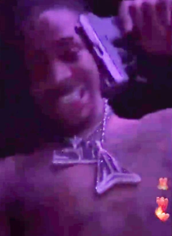 Ja Morant holding a gun at a strip club on an Instagram Live video on March 4, 2023.