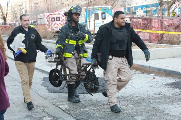 City workers removing the e-bike/scooter that caused the fire.