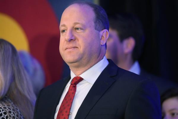 Colorado Gov. Jared Polis speaks on Nov. 8, 2022, in downtown Denver. 