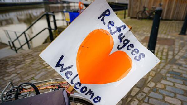 A 'refugees welcome' banner attached to a bicycle by a small flotilla of boats leaving Bristol harbour in support of Ukrainian refugees during a day of natio<em></em>nal action showing support for refugees. Picture date: Mo<em></em>nday March 21, 2022.